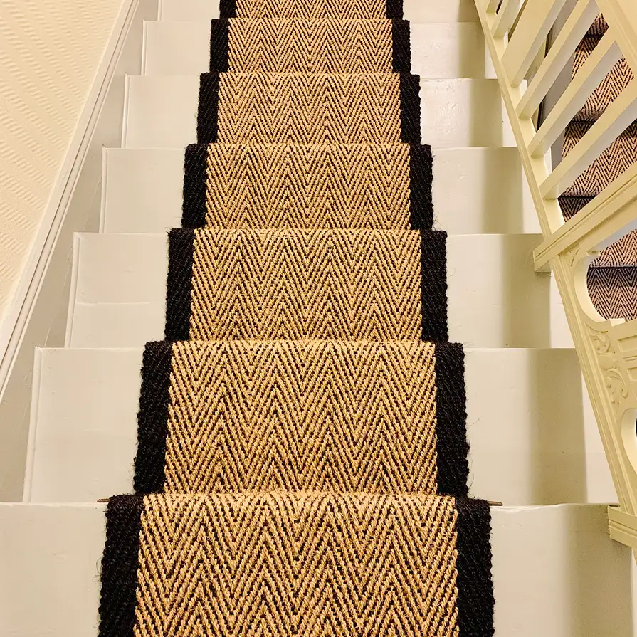 narow stair runner in gold and black